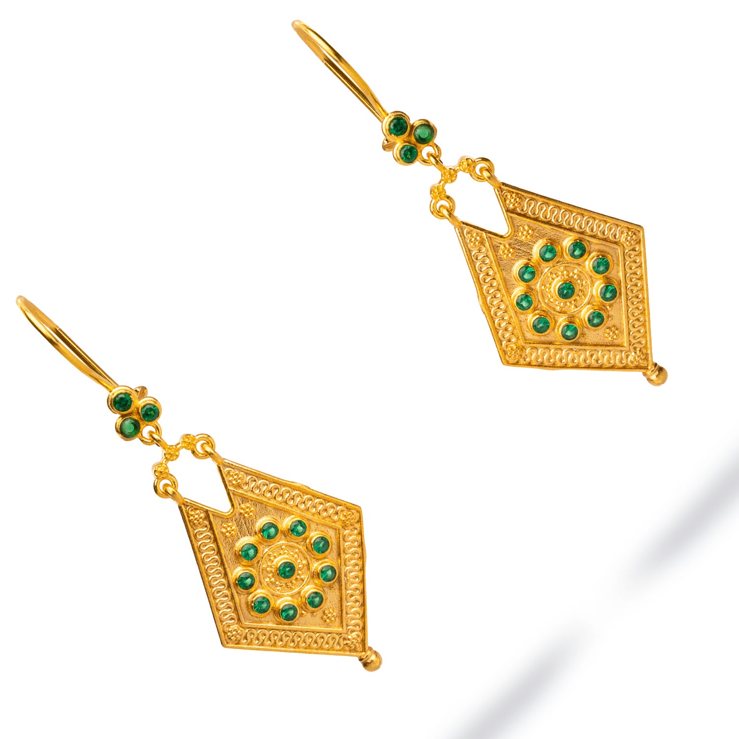 Chic vintage-inspired dangle earrings with emerald stones and 24k gold plating, ideal for enhancing both special and everyday outfits.
