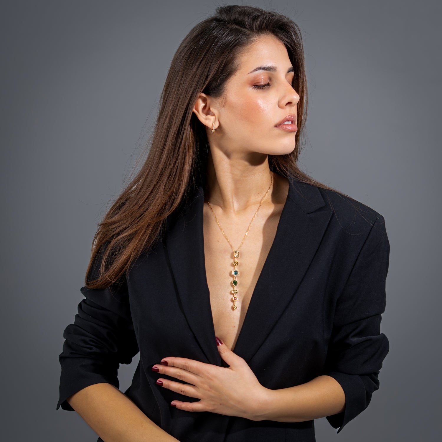 Vivid Veil gold Y-drop statement necklace with cascading multicolor gemstones and CZ accents on an 18k gold-plated stainless steel chain.
