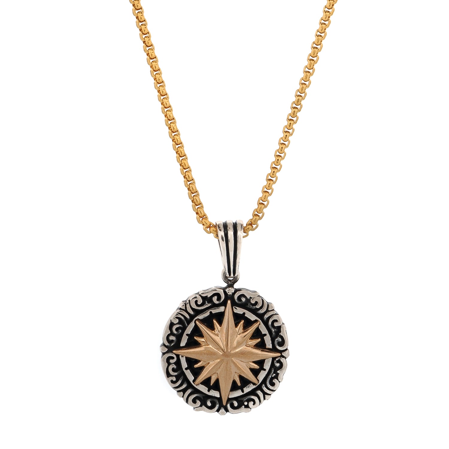 Close-up of oxidized sterling silver compass rose pendant with 18k gold detail