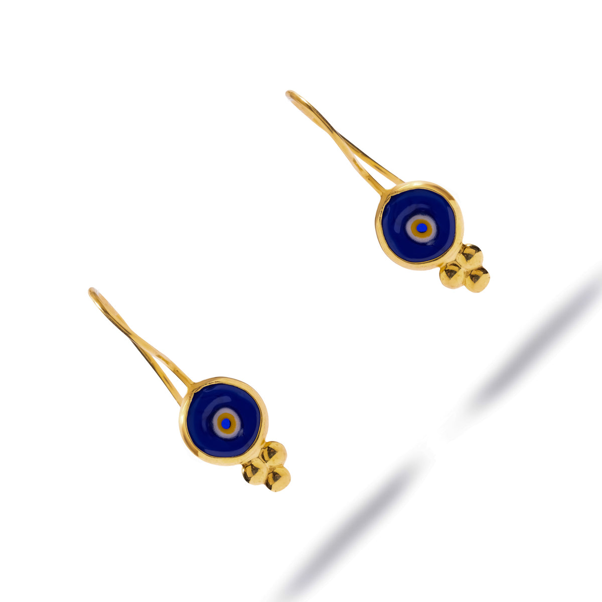 Pair of Watch Over Me blue glass evil eye earrings on white, showing the gold bead cluster