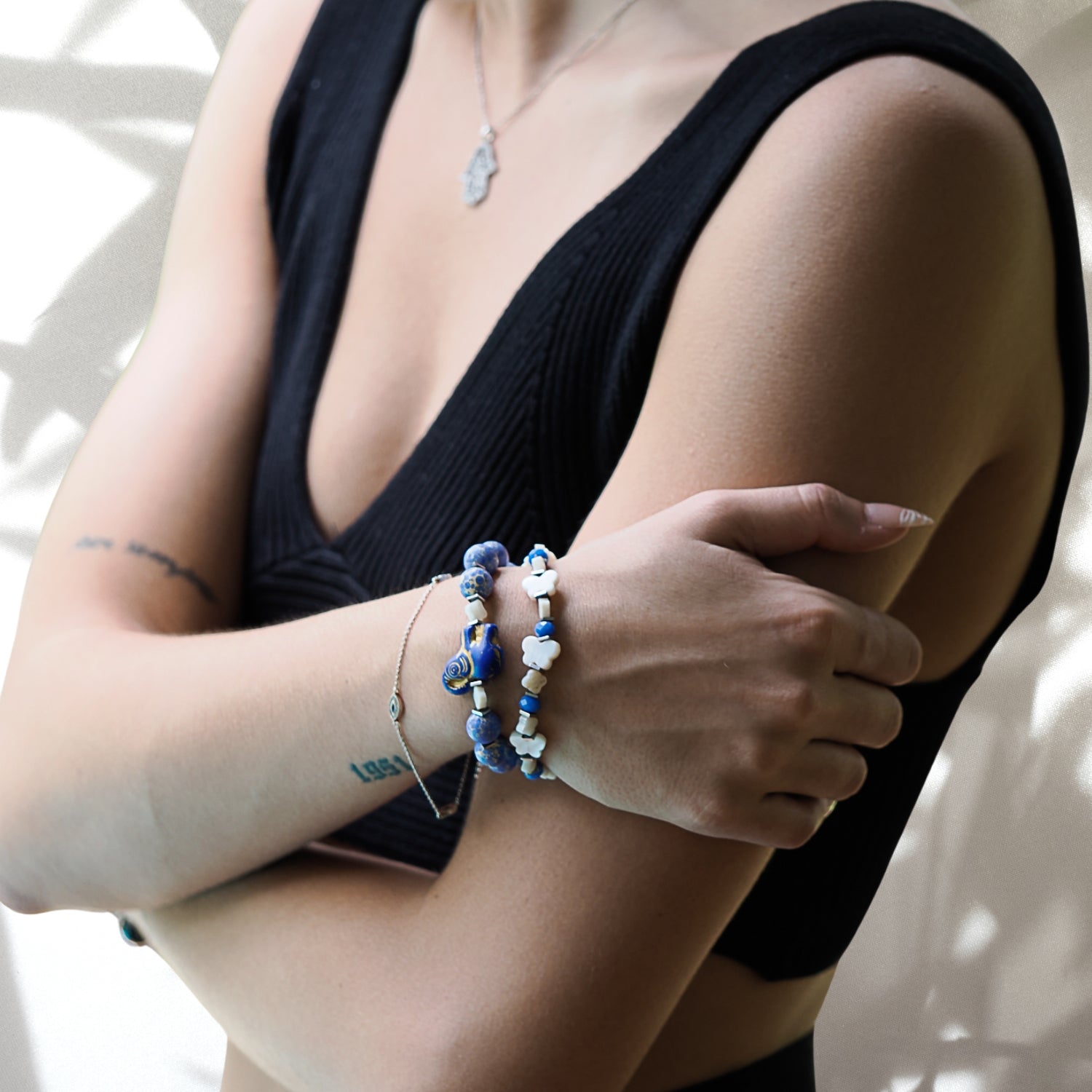 Hand model showcases the beauty and meaning of the Wish Your Dreams Bracelet Set, featuring Jasper stone beads and symbolic accents.