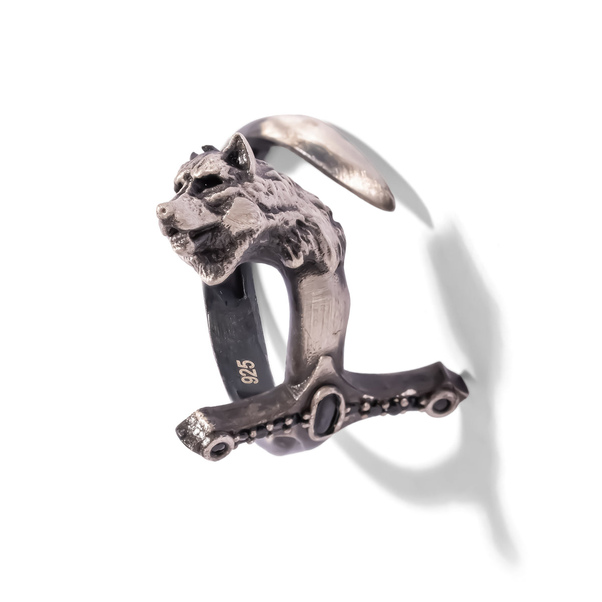 Close view of the wolf head and black zircon sword hilt on the men's oxidized sterling silver ring