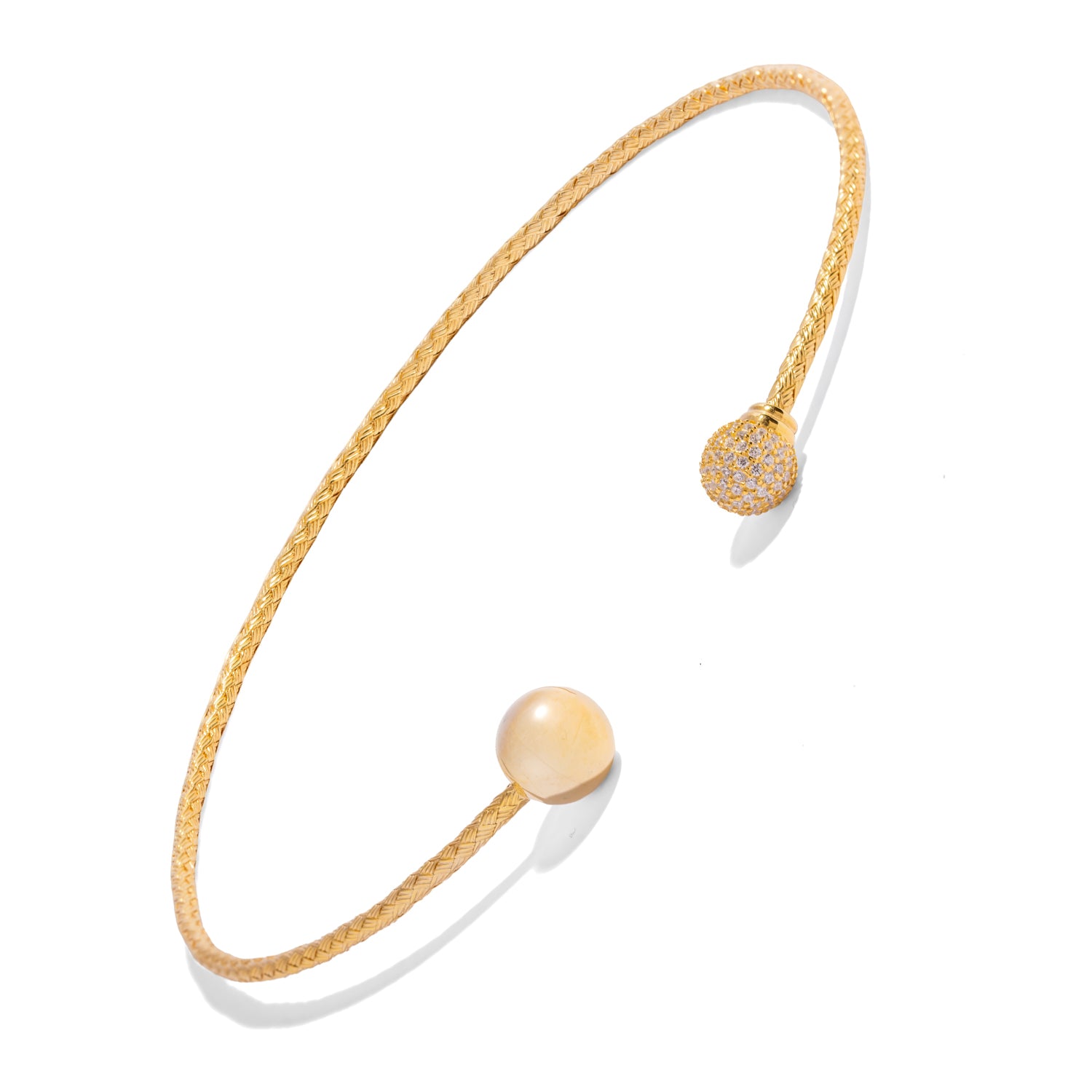 Close up of woven gold vermeil choker necklace showing polished sphere and pave zircon sphere terminals