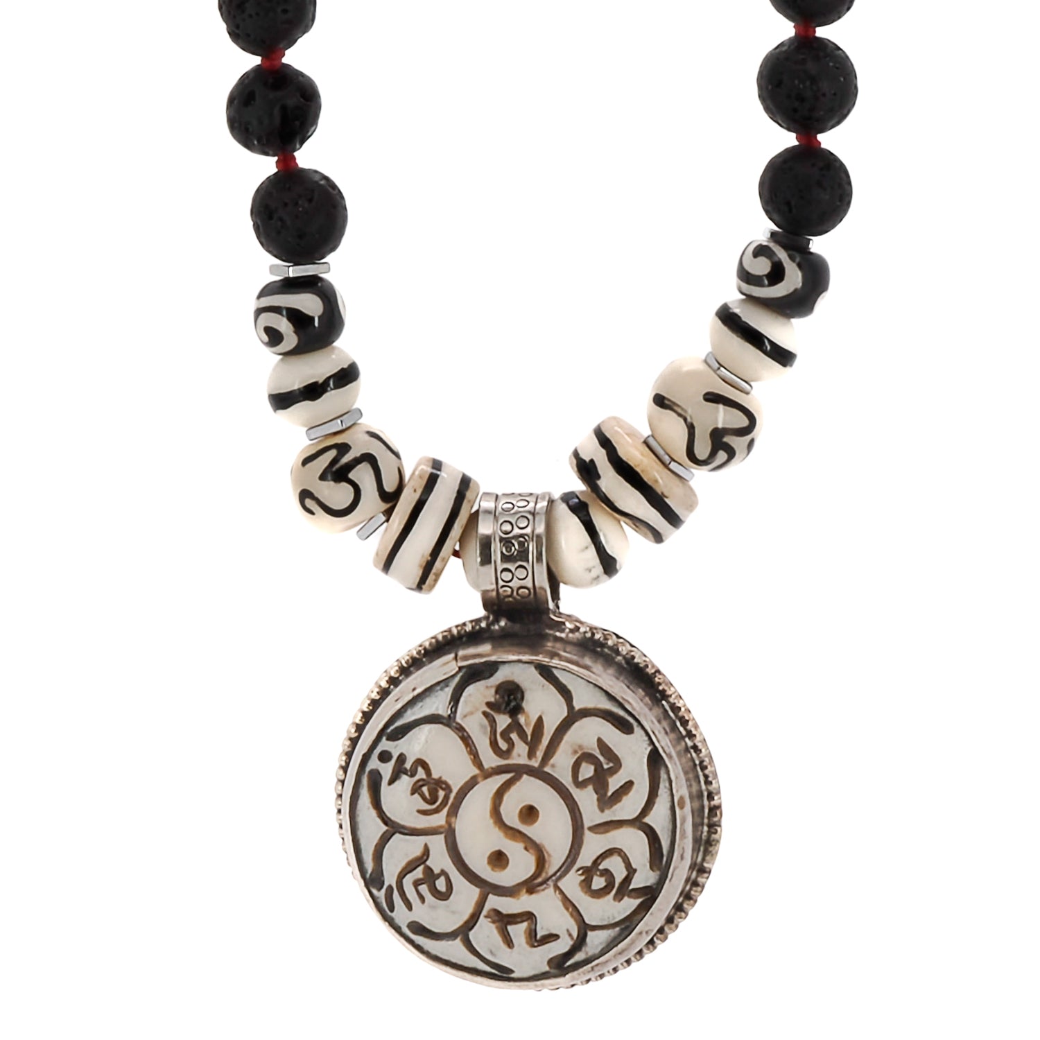 Necklace featuring black lava rock beads and a captivating Yin Yang pendant, symbolizing the interplay of opposing forces.