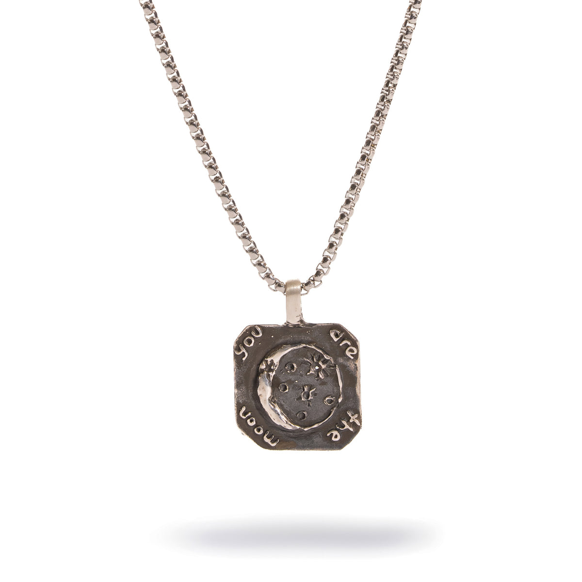 You Are The Moon engraved sterling silver pendant on a box chain, with a crescent moon and stars at the center and the words around the edge