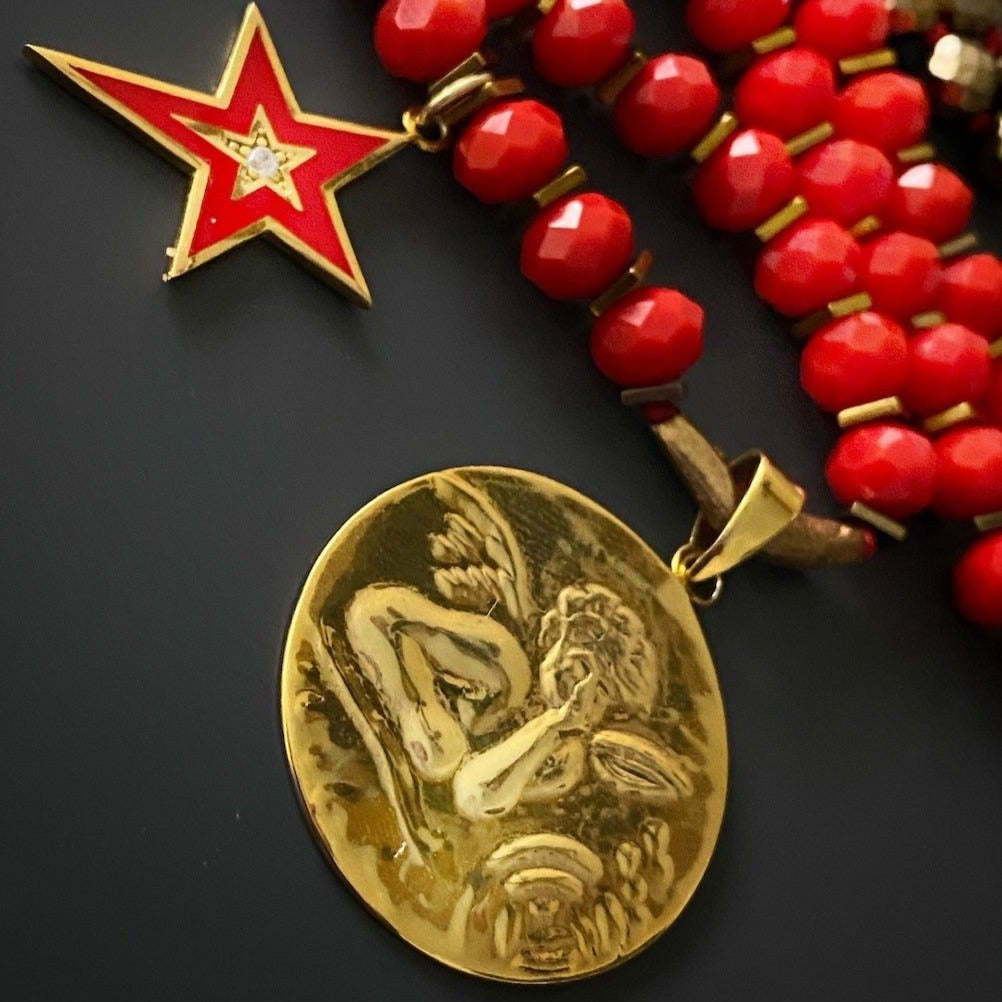 The Angel Protector Necklace&#39;s red enamel star charm adds a playful touch to this meaningful piece of jewelry
