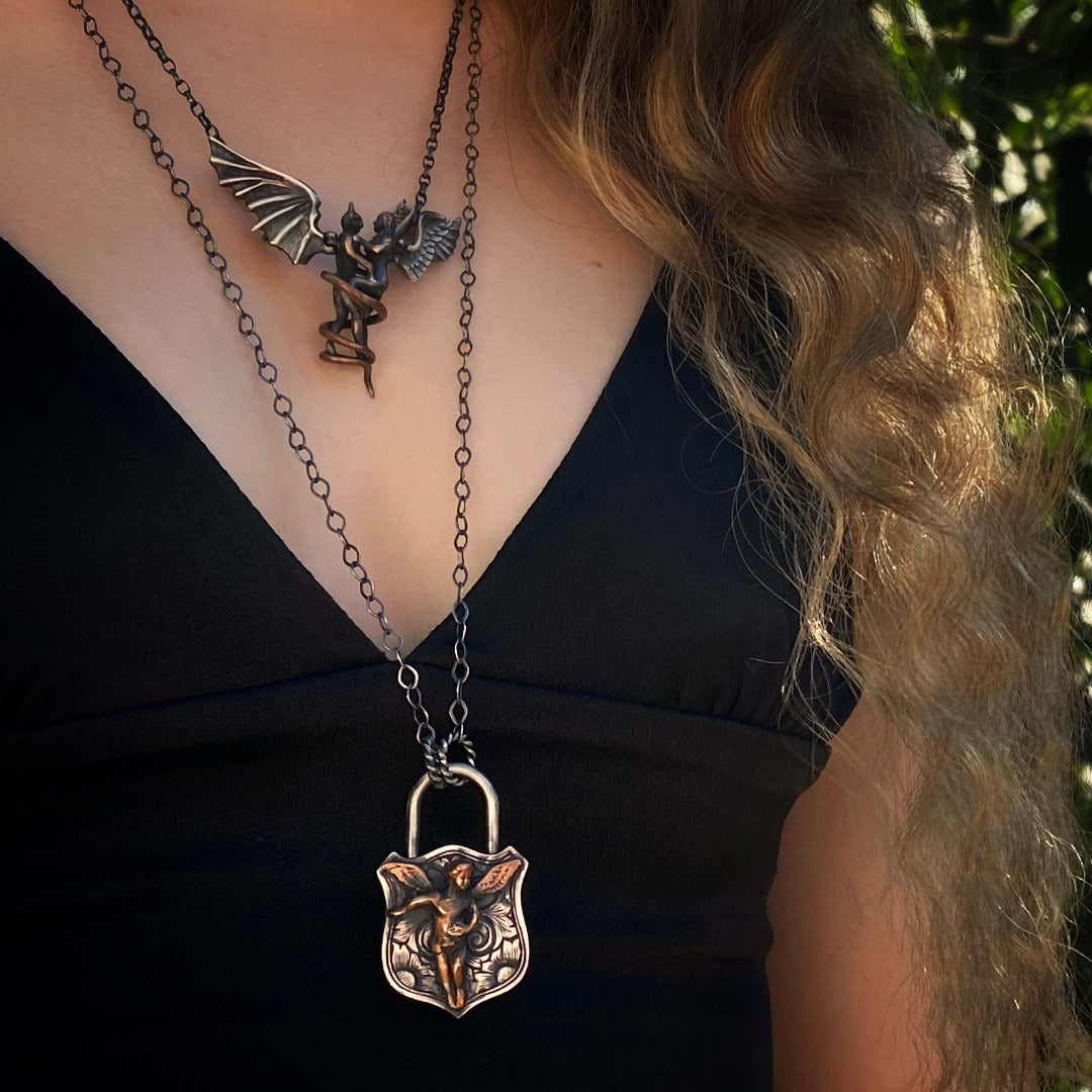 Experience the Elegance and Spirituality of the Angel Lock Necklace with a Model Wearing It
