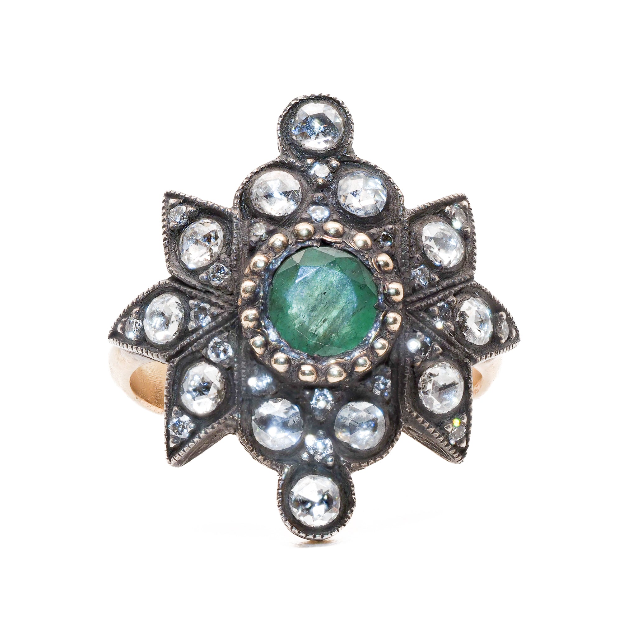 The Emerald Star Ring features a stunning 0.53ct natural emerald surrounded by 0.66ct diamonds, set in a luxurious combination of 14k yellow and silver gold.