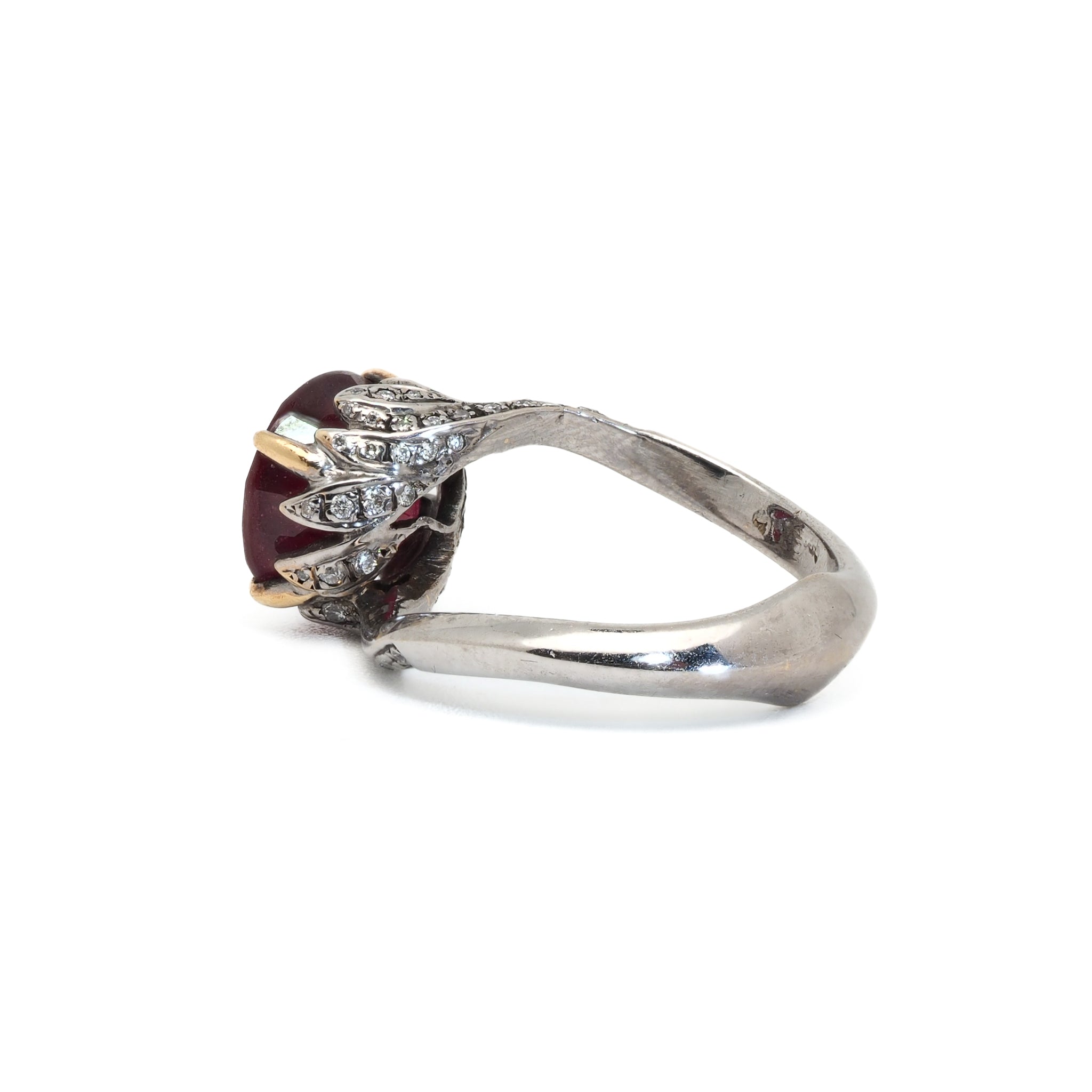 Unique and Elegant - Twisted Ruby Engagement Ring, a special addition to any look.