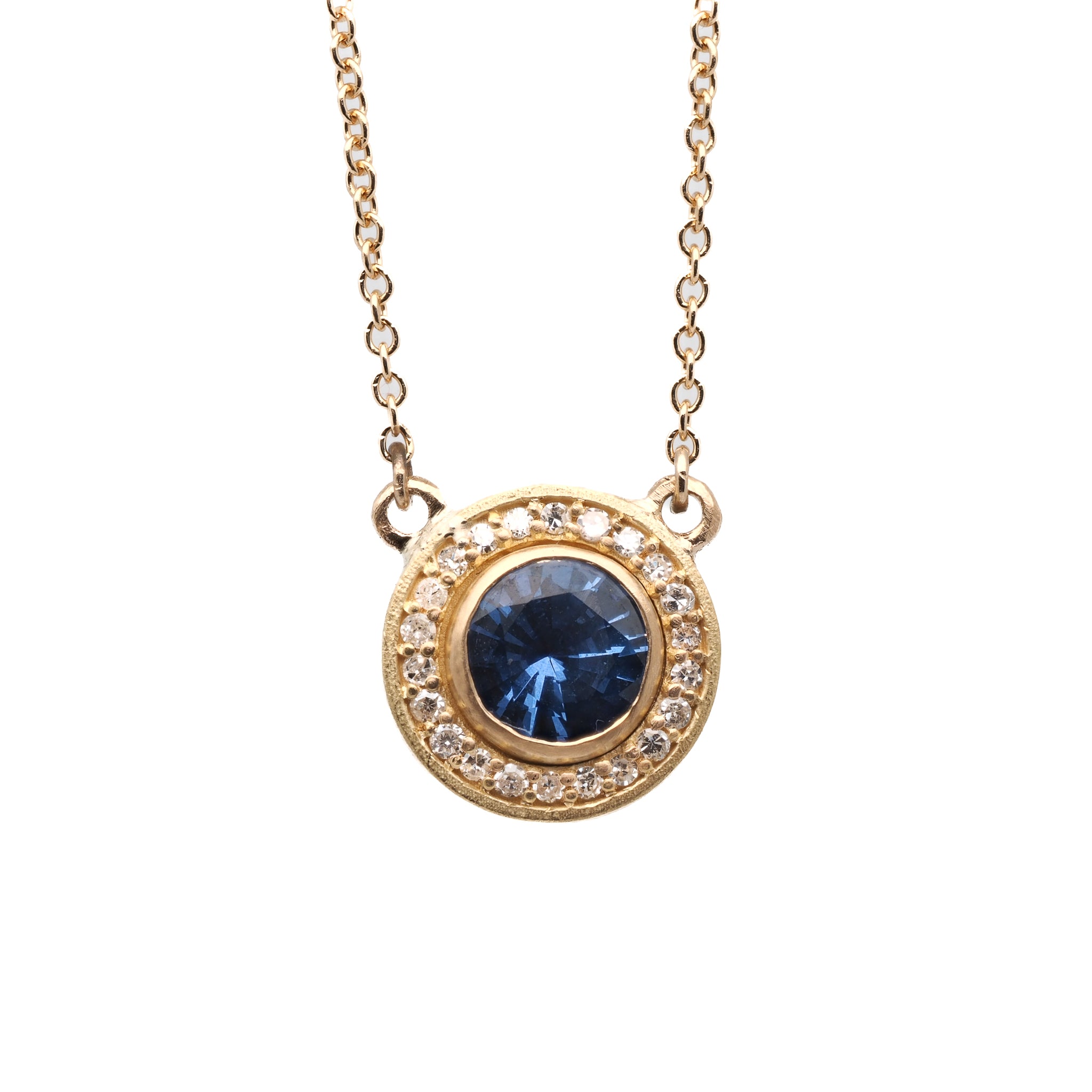Close-up of the Elegant Sapphire Necklace showcasing the exquisite 18k yellow gold pendant adorned with a mesmerizing 1ct sapphire and sparkling 0.30ct diamonds.