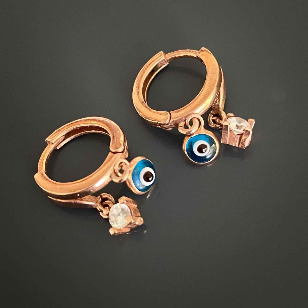 The Baby Evil Eye Earrings are the perfect balance of elegance and protection.