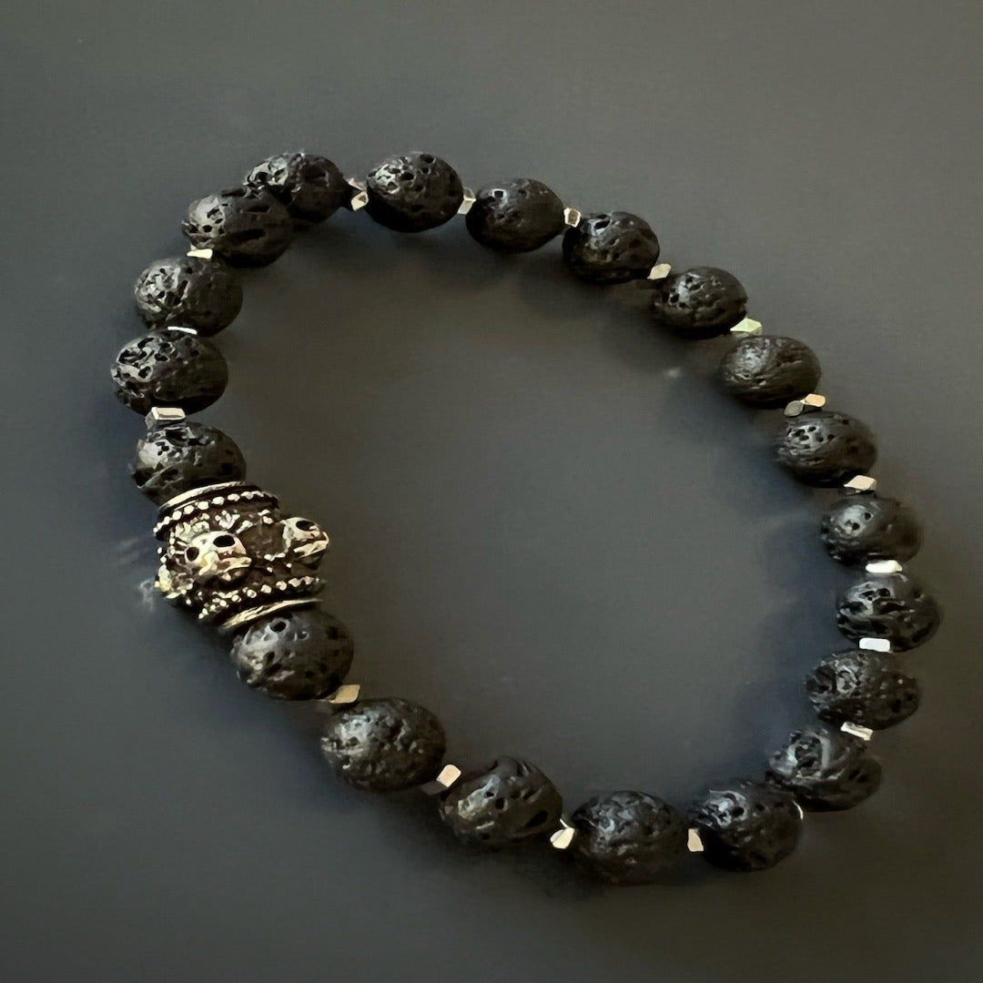 Handmade with attention to detail and quality, the Black Balance Bracelet features black lava rock stone beads, silver hematite spacers, and a stainless steel black skull bead.