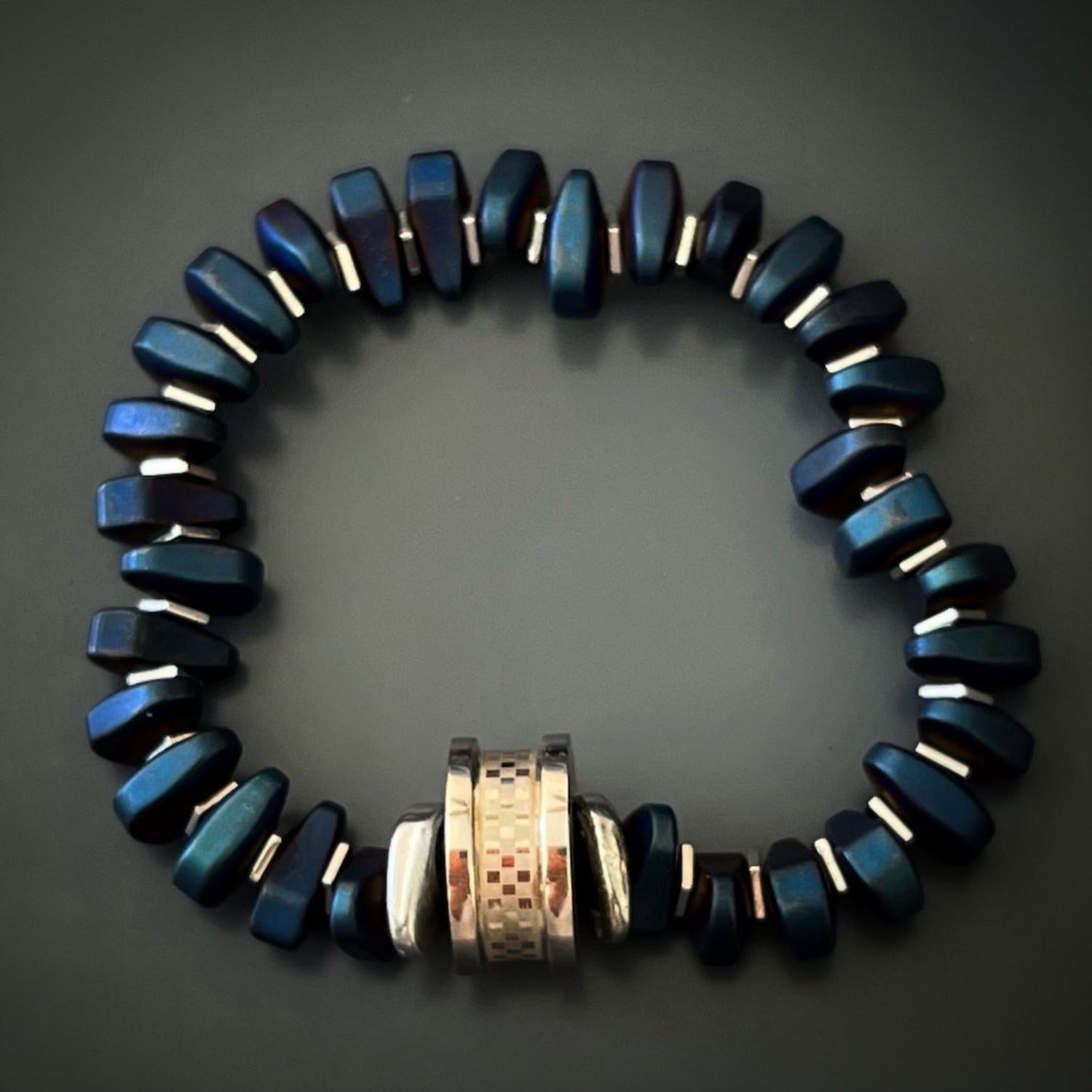 The calming blue hue of the hematite beads on the Blue Amour Men Bracelet