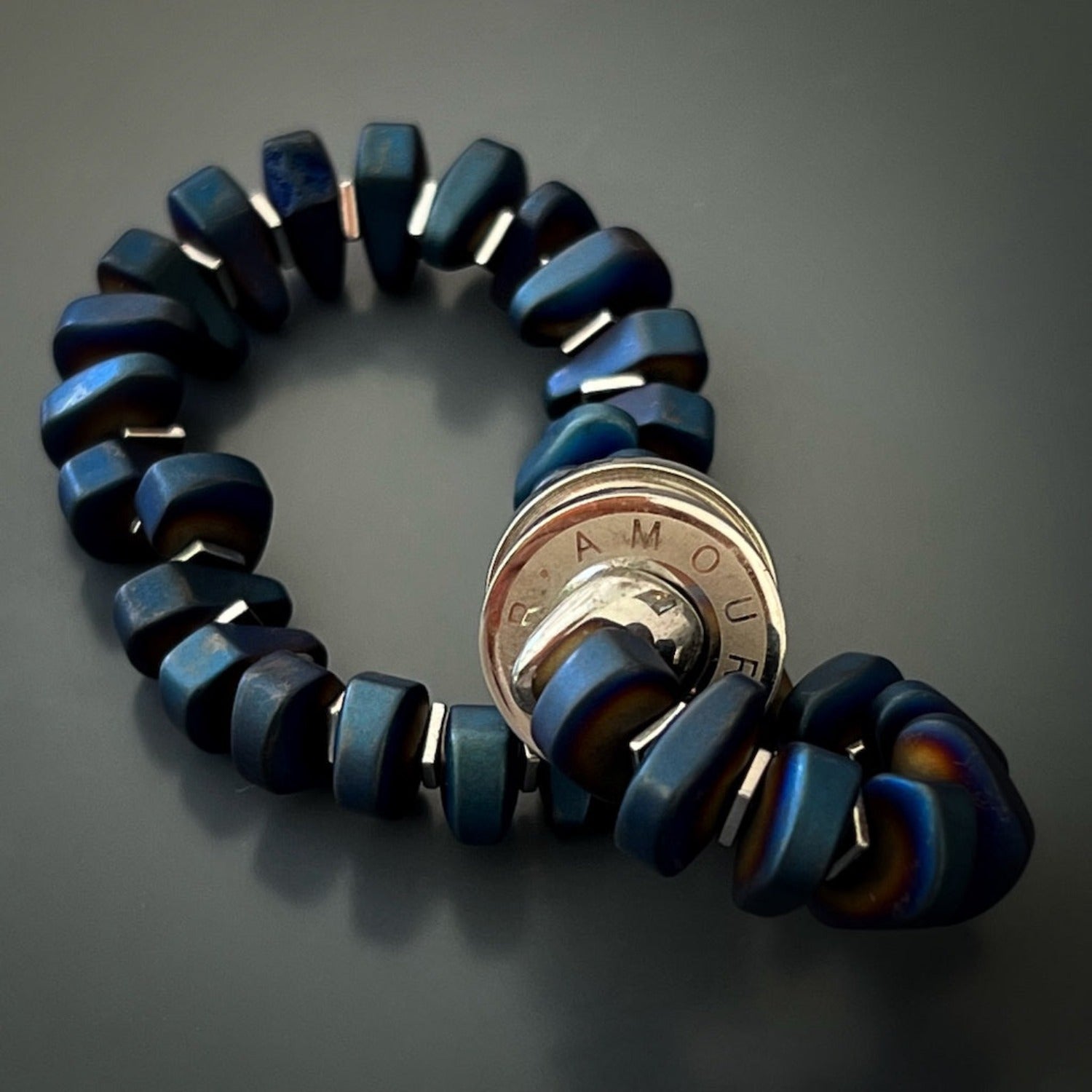 The silver color hematite stone spacers adding a stylish touch to the Blue Amour Men Bracelet
