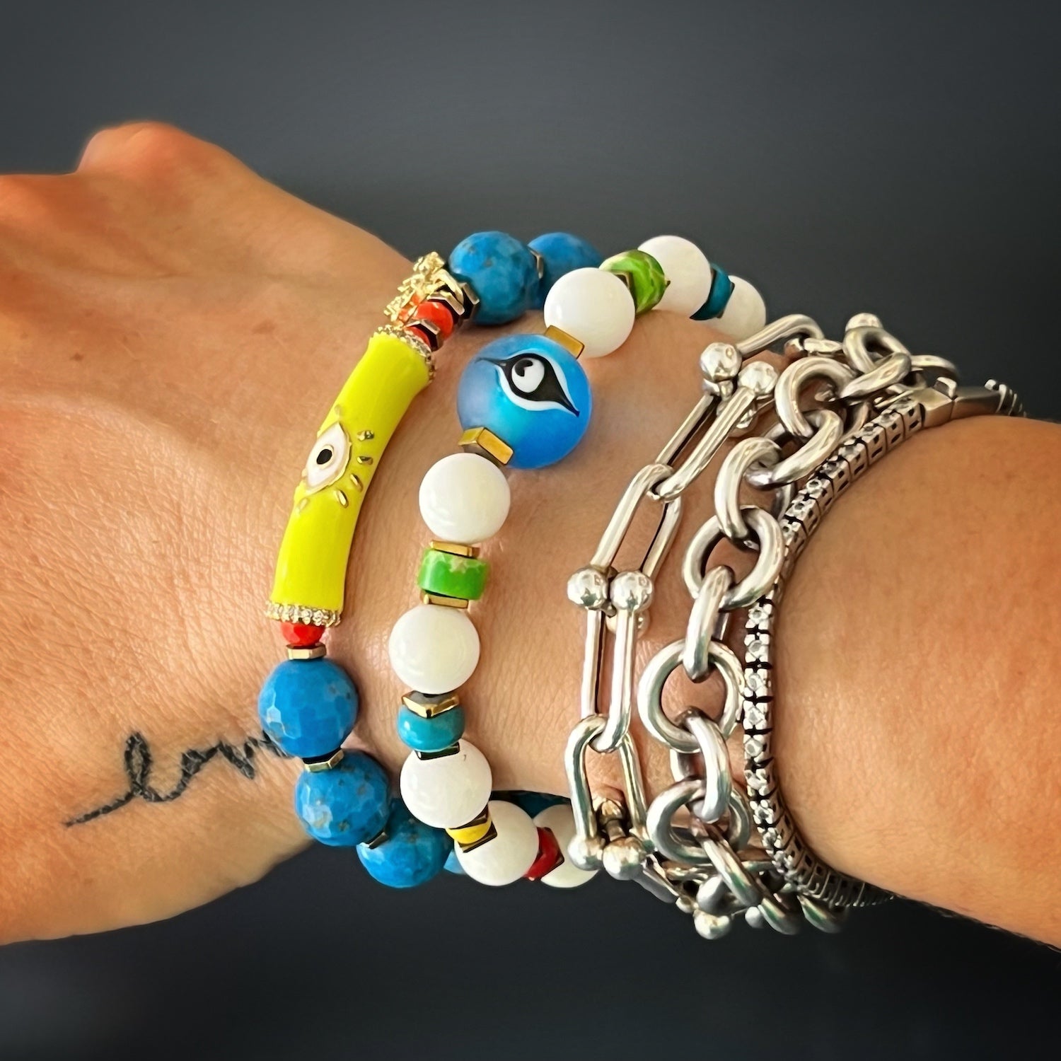 Model showcasing the Blue Evil Eye Bracelet with Glass Evil Eye Charm and Variscite Stone Beads