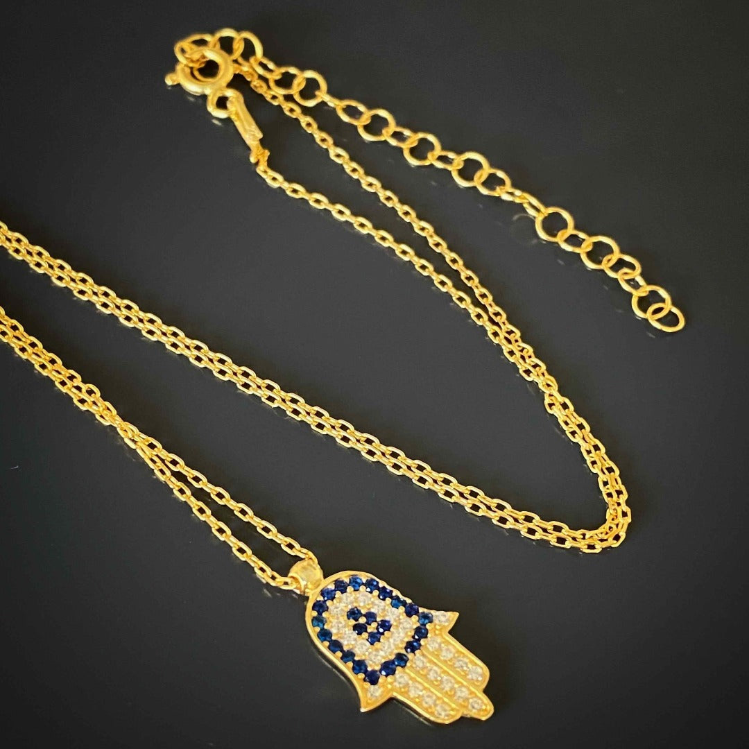 Elegant Blue and Gold Necklace with a Hamsa Charm