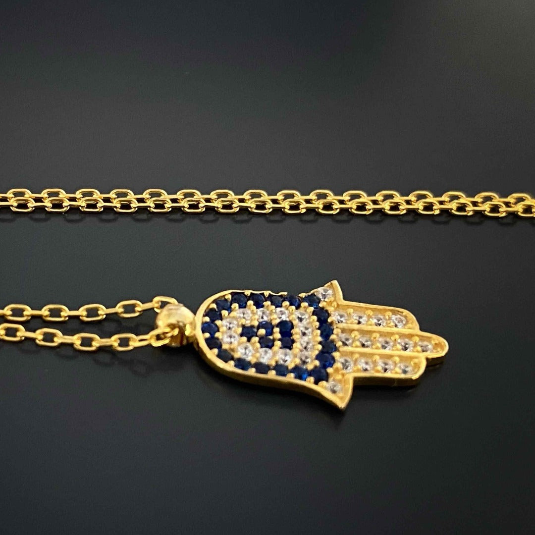 Detailed Blue and Gold Hamsa Necklace with Swarovski and CZ Diamond accents