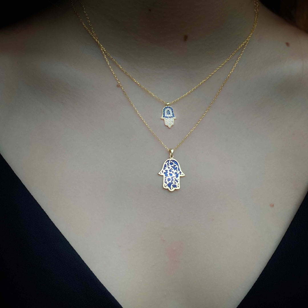 Model wearing Blue and Gold Minimal Hamsa Necklace with Swarovski and CZ Diamond stones