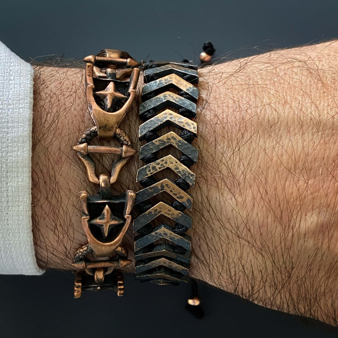 Another image featuring a model wearing the Bronze Unique Men Wings Bracelet, highlighting its unique wing and star design on the wrist.