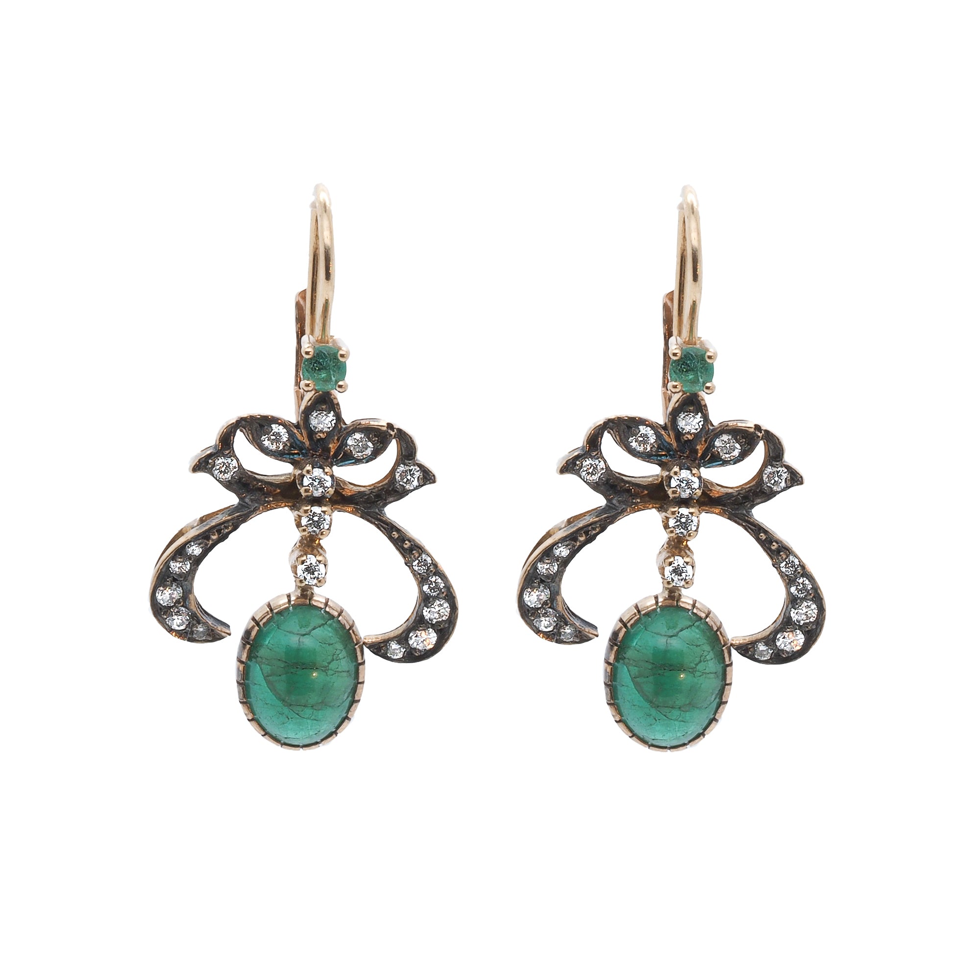 Cabochon Emerald Earrings shining brightly in the sunlight, showcasing their exquisite craftsmanship and natural beauty.