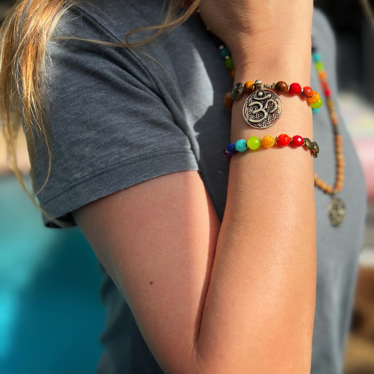 Model Wearing Chakra Balance Bracelet, a beautiful and meaningful piece for aligning your energy centers and promoting overall well-being.