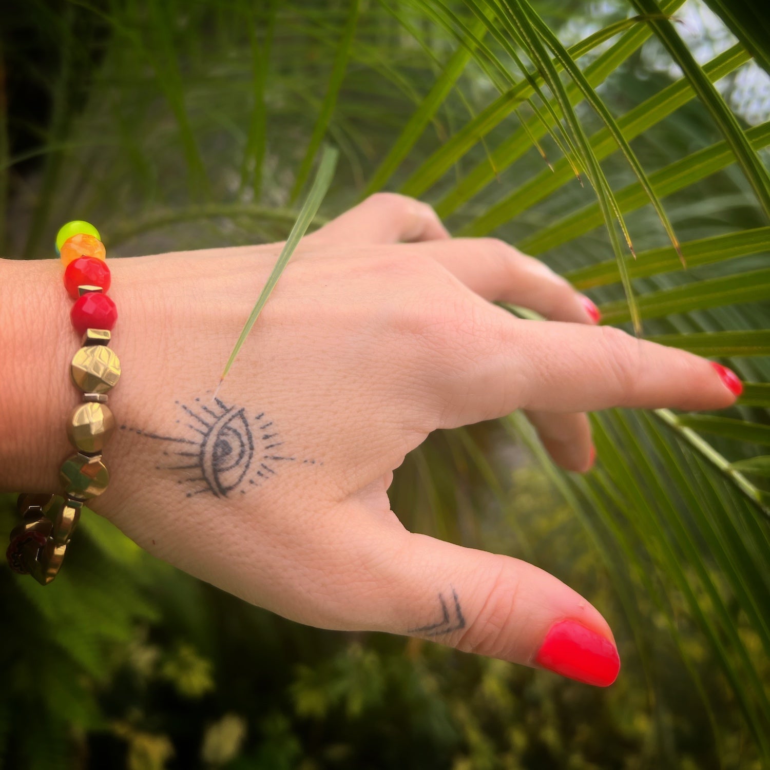 Hand Model Wearing Chakra Balance Bracelet with Natural Stone Beads, embracing the power of crystals for a balanced and harmonious life.