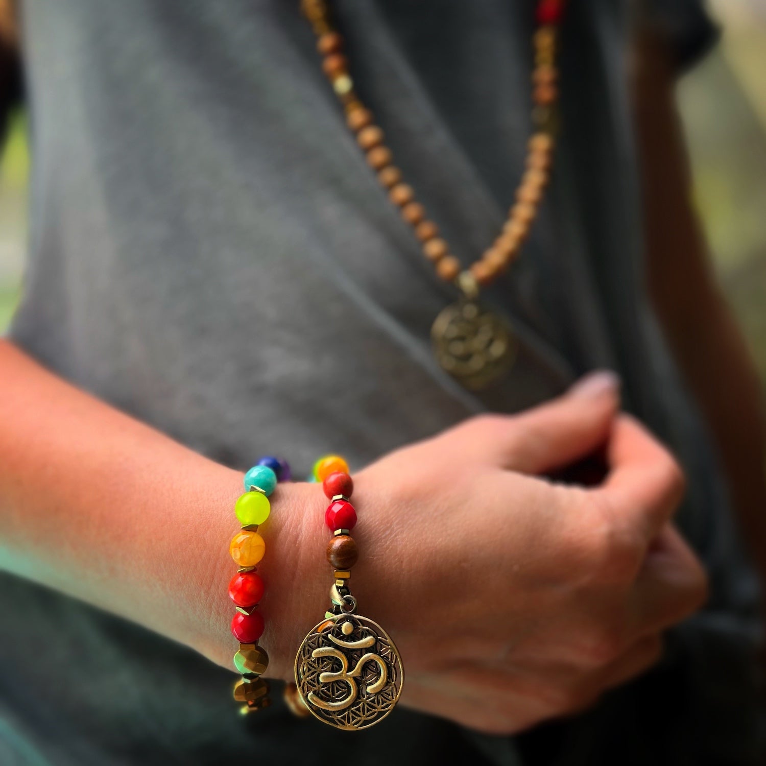 Model wearing the Chakra Mini Mala Talisman Bracelet, a symbol of balance and protection.