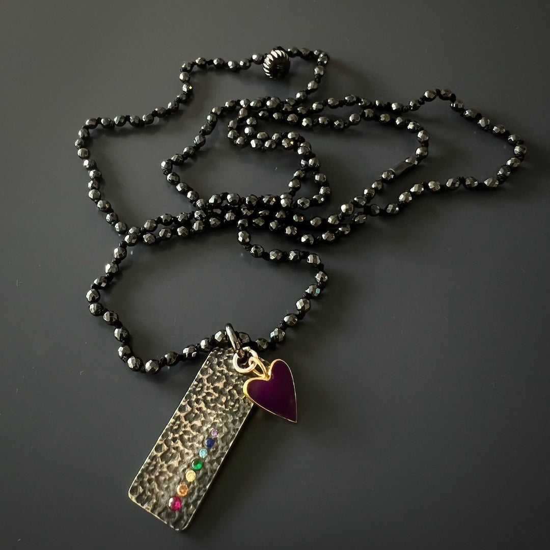 Experience inner harmony with the Chakra Balance Necklace&#39;s hematite beads and chakra pendant.