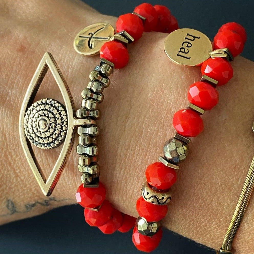 Stylish Hand Model Wearing Red Crystal Evil Eye Bracelet: Experience the beauty and elegance of this bracelet as it adorns the wrist, combining fashion and symbolism.