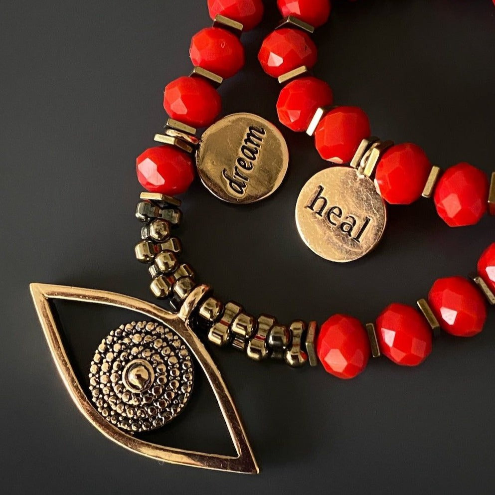 Red Crystal Double Bracelet with Evil Eye Pendant: The combination of red color crystals and a handmade bronze Evil Eye pendant makes this bracelet a powerful talisman against negativity and an eye-catching accessory.