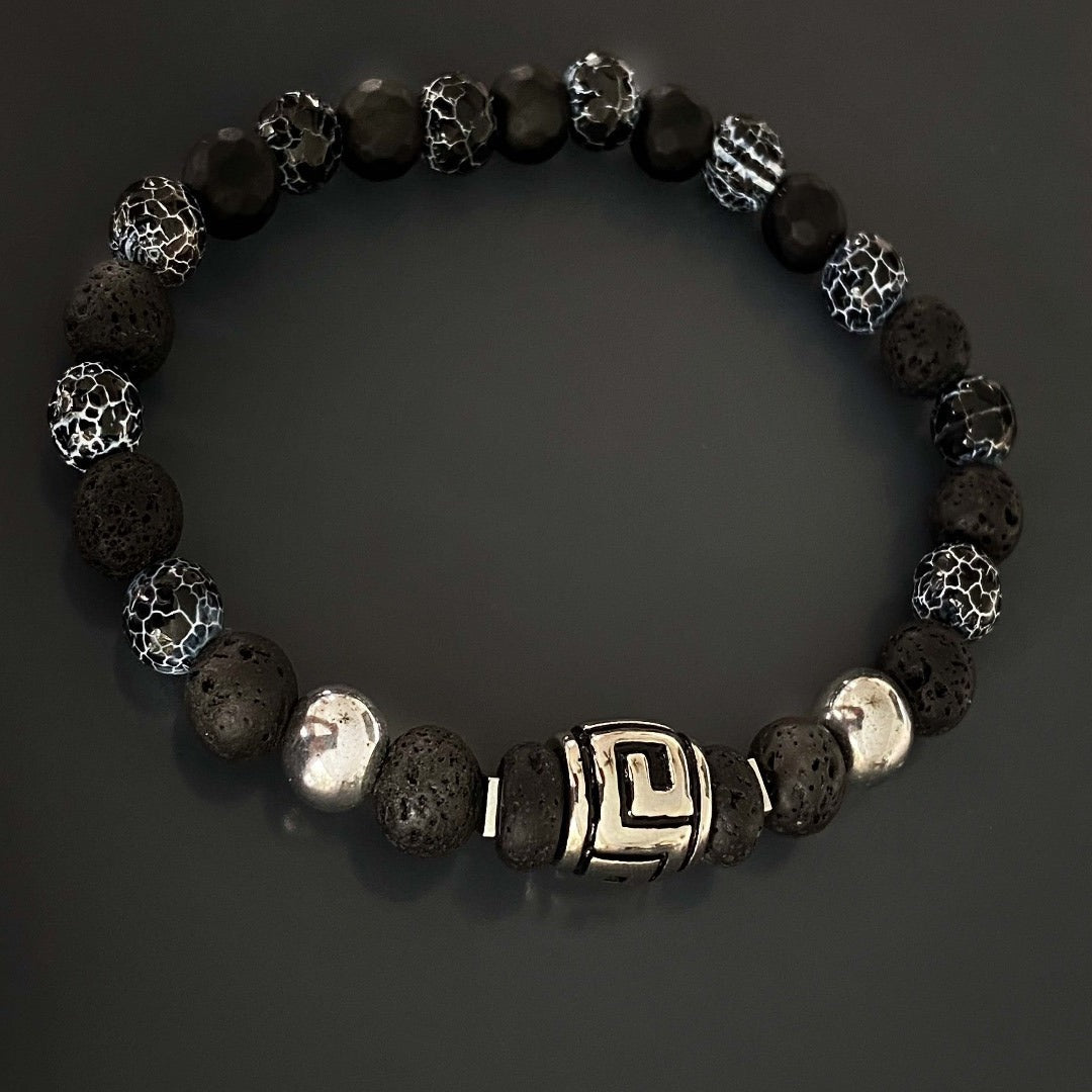 Handcrafted with black lava rock and crackle agate stone beads, the Courage Lava Rock Men&#39;s Bracelet promotes inner strength and confidence. This stylish accessory is thoughtfully designed to inspire fearlessness and determination.