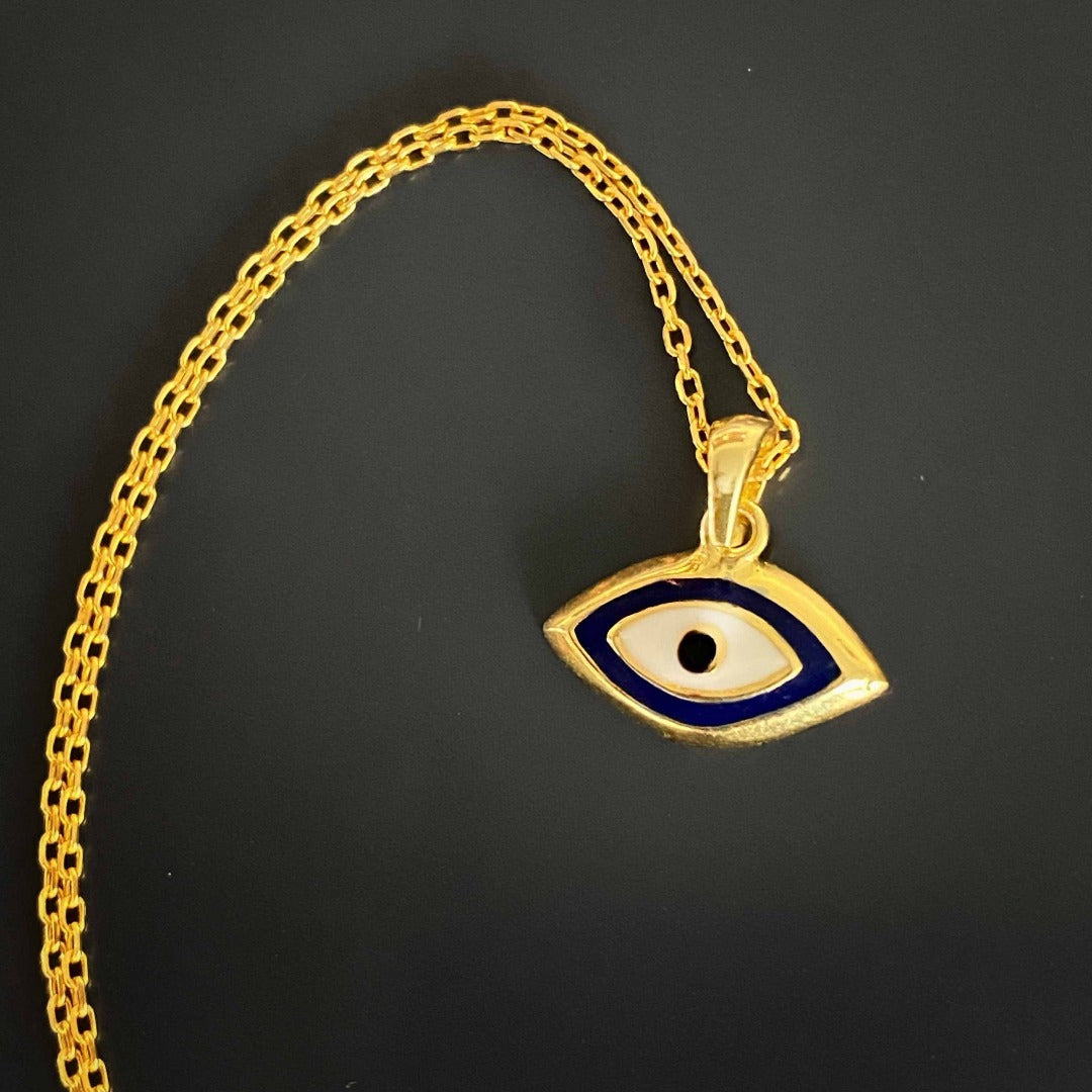The Dainty Evil Eye Necklace in 18k gold plated variant, showcasing the rich golden color of the pendant and chain.