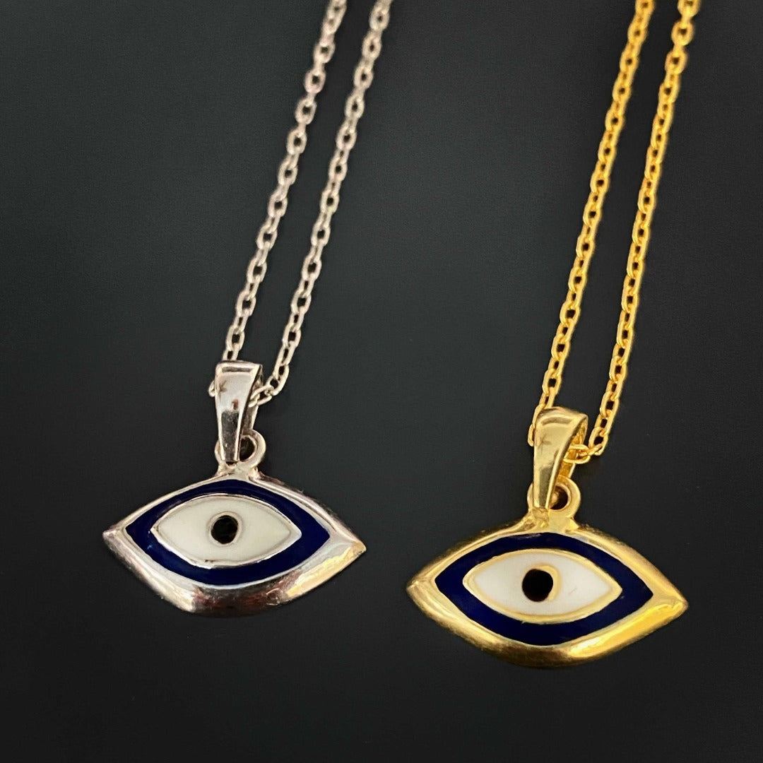 Dainty Evil Eye Necklace in sterling silver featuring a small evil eye charm on a delicate chain. The necklace is simple and perfect for everyday wear.