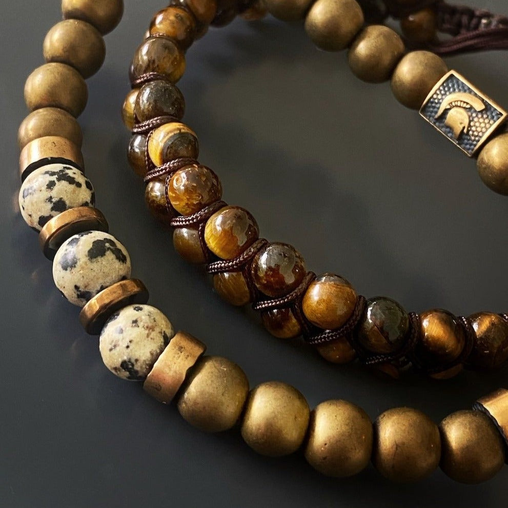 An image showcasing the Dalmatian Jasper Hematite Bracelet, highlighting the ability of the stones to clear electromagnetic smog and stimulate the imagination.