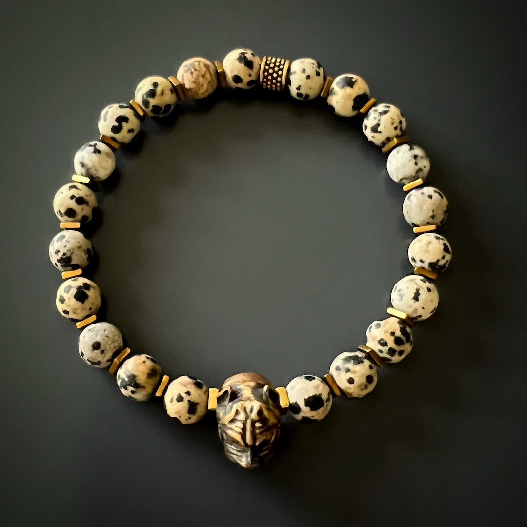 An image displaying the Dalmatian Jasper Dog Bracelet, showcasing the elegant design and meaningful combination of materials, including the dalmatian jasper stones and the bronze dog charm.