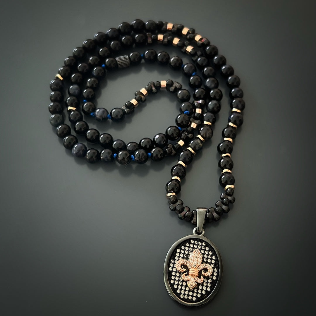 Close-up of the Fleur de Lis pendant on the Diamond Men's Necklace, showcasing the intricate details and sparkling diamonds.