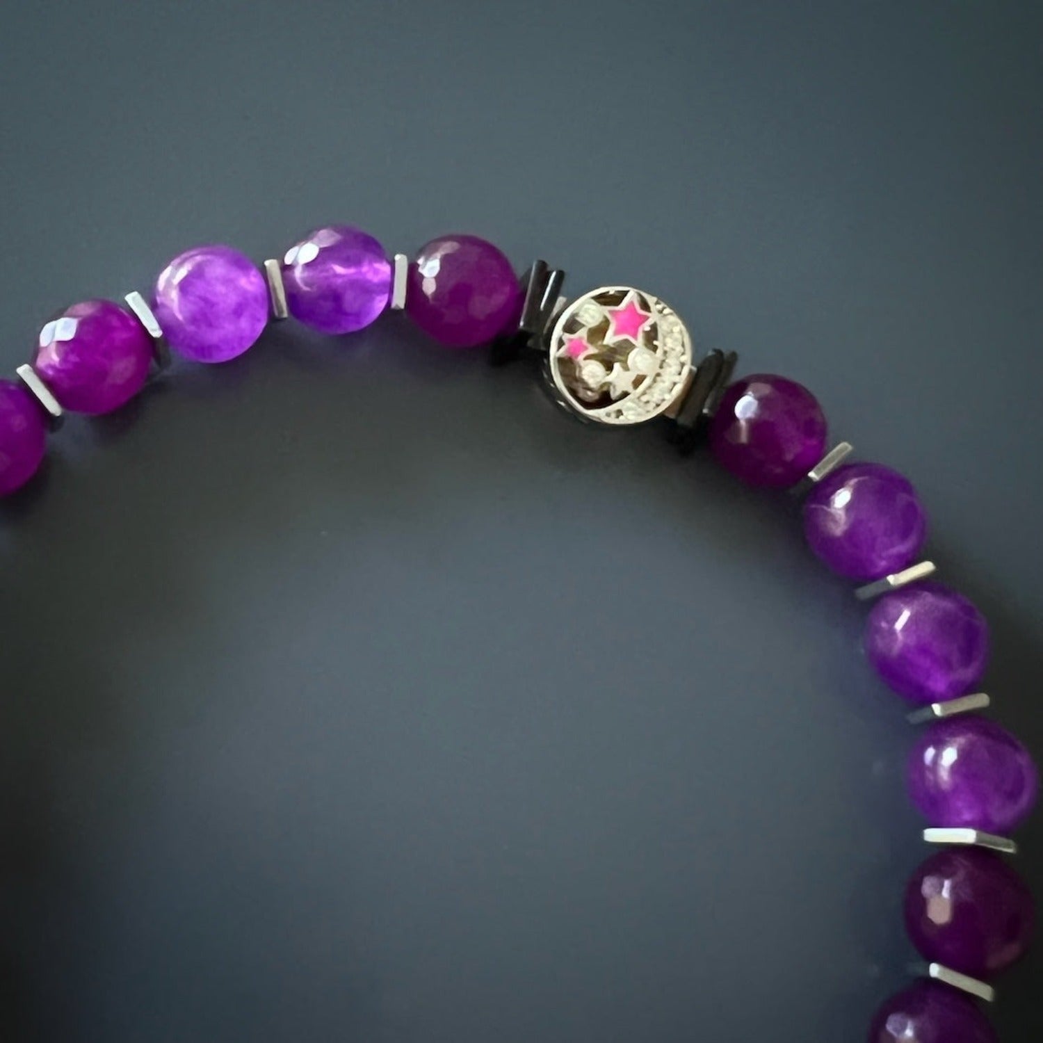 Stunning ankle bracelet adorned with purple jade beads and a silver dragonfly charm.