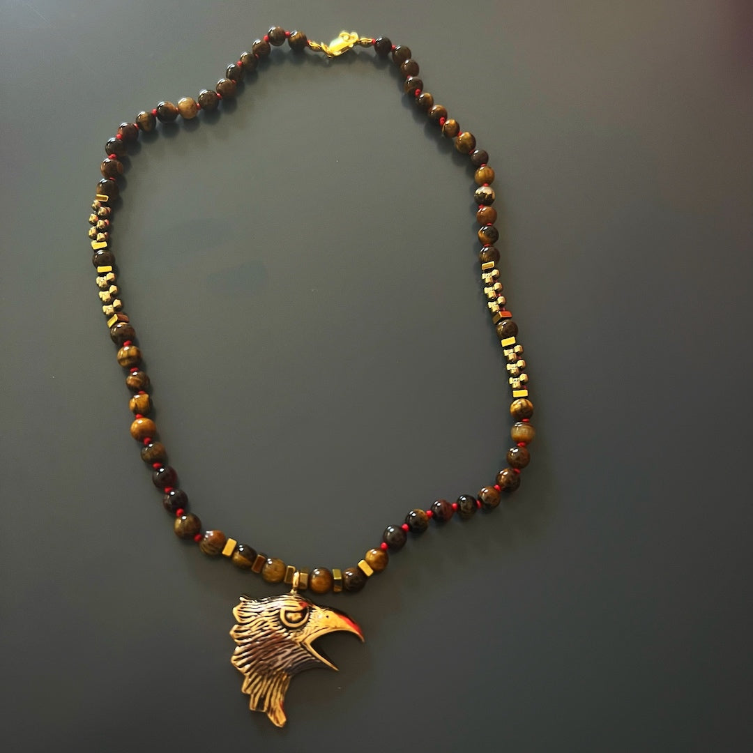 Healing Tiger&#39;s Eye Necklace with Handcrafted Eagle Spirit Pendant, providing balance and motivation to the wearer.