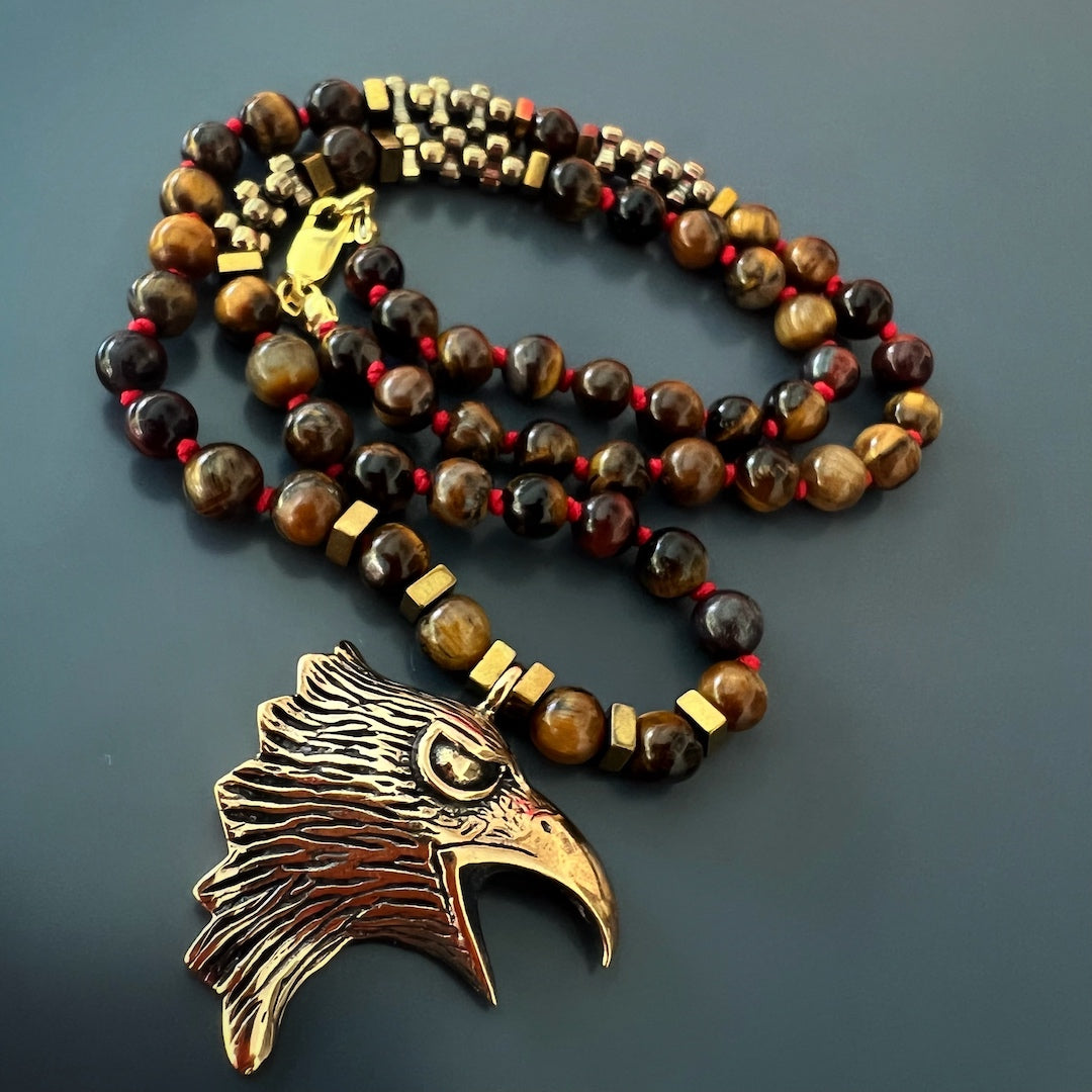 Tiger&#39;s Eye Beaded Necklace with Bronze Eagle Charm, a symbol of strength and protection.