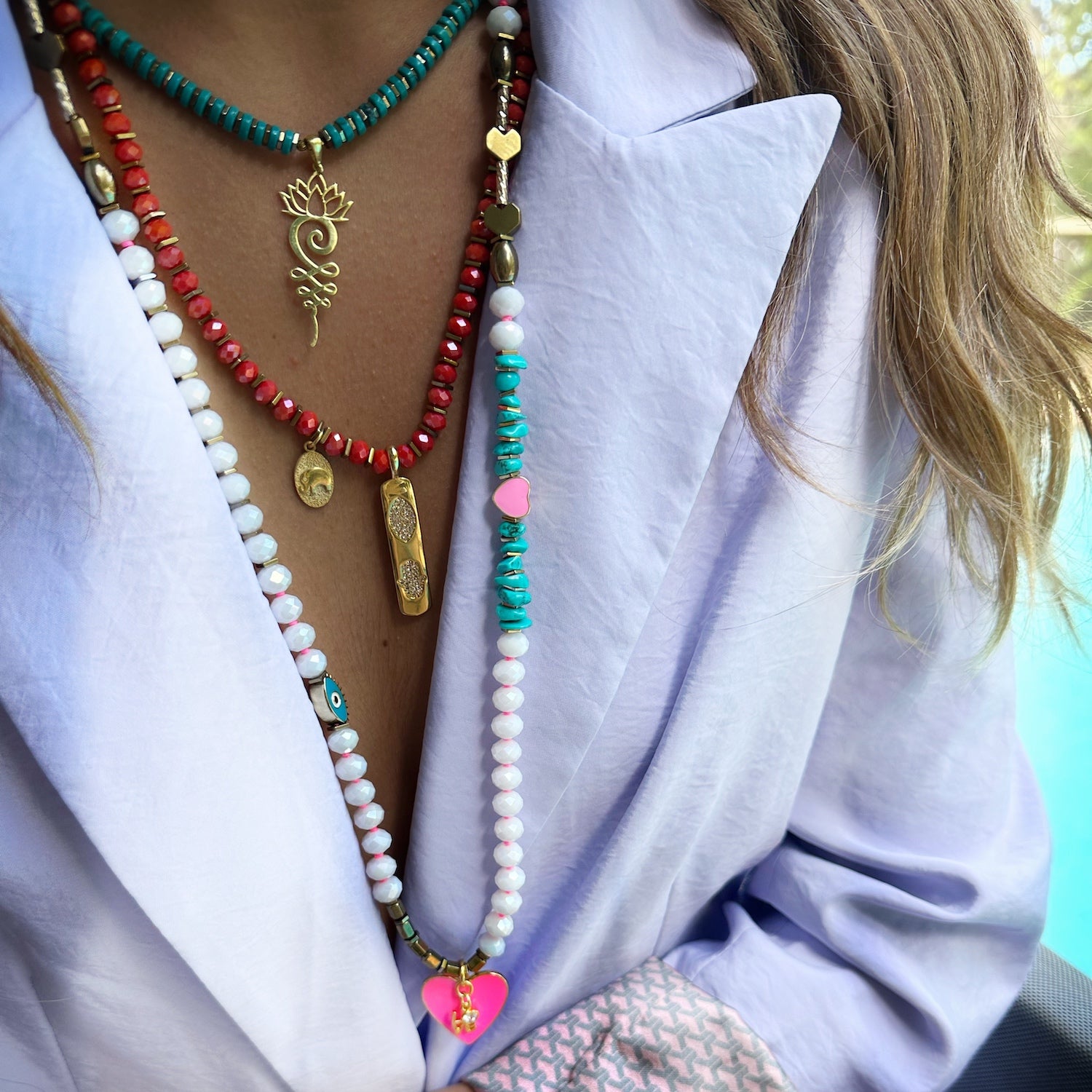 Model wearing the beautiful Eternal Love Necklace, featuring turquoise nugget beads and gold accents.
