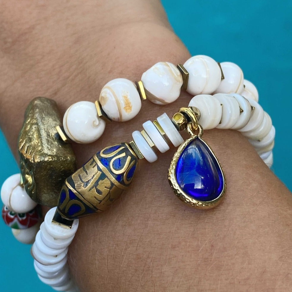 Hand model wearing Ethnic Fashion Bracelet Set - A hand model wearing the Ethnic Fashion Bracelet Set, showcasing the stunning combination of Nepal bone beads, colorful African beads, and gold-plated accents. 