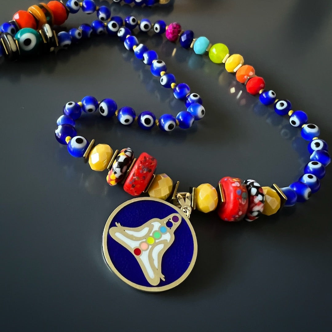 Evil Eye Chakra Mala Necklace with colorful African beads and glass evil eye beads.