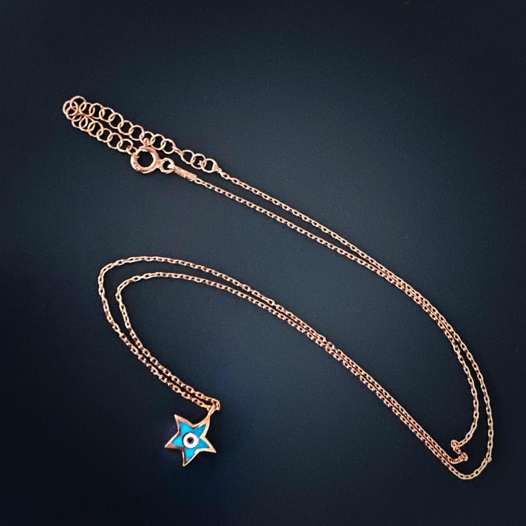 Handmade Evil Eye Gold Star Necklace, a dainty and protective talisman with a star-shaped evil eye pendant.