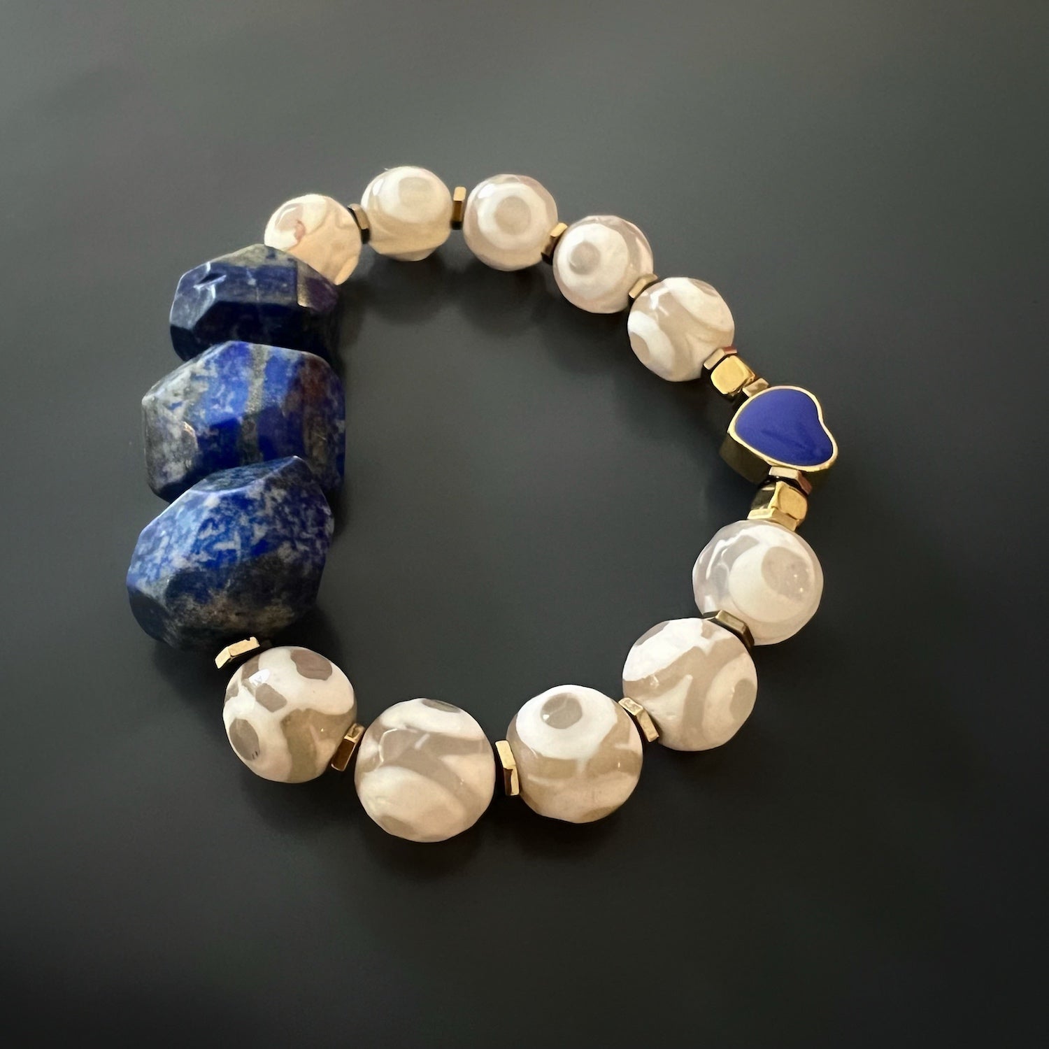 Eye-catching Lapis Lazuli Bracelet - Unique piece of handmade jewelry with deep blue Lapis Lazuli beads and a contrasting gold enamel heart.