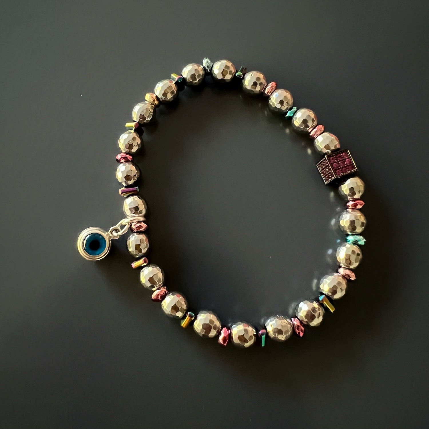 Handmade Eye Protection Bracelet Set - Combination of silver hematite beads, Evil Eye charms, and pink/blue hematite spacers for a stylish and protective accessory