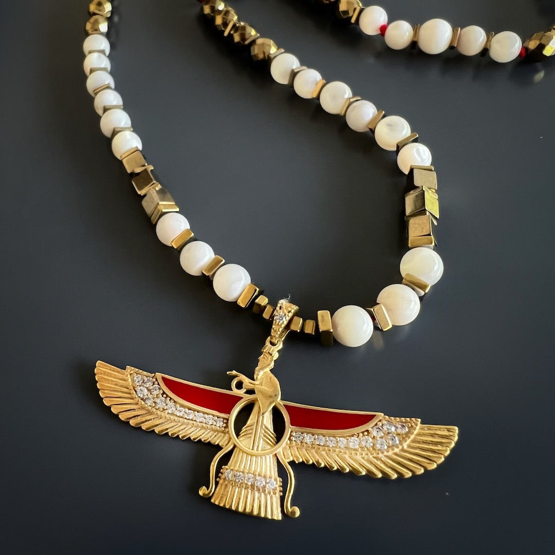 Intricate Faravahar Pendant Necklace - Handcrafted accessory featuring divine protection and guidance, gold hematite and pearl stone beads for spiritual transformation.