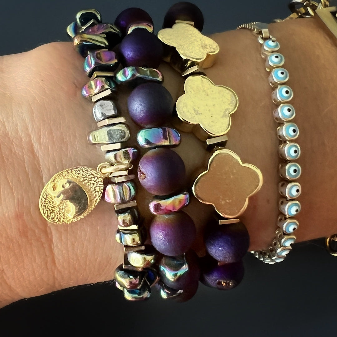 Stylish Hand Model showcasing Fleur de Li Agate Bracelet - Meticulously crafted accessory with a stunning Fleur de li charm and natural stone beads