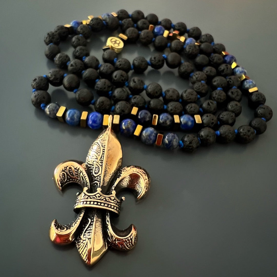 Handcrafted Fleur de Lis Necklace - Unique accessory with lava rock and lapis lazuli beads, and a handmade bronze pendant, representing grounding, emotional balance, and spiritual significance