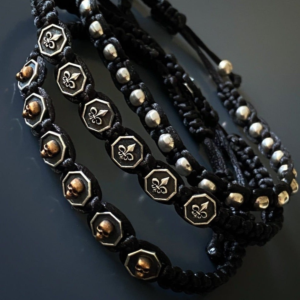 Men's Fleur De Lis Woven Bracelet - Handmade jewelry piece designed for bold and fashionable men, featuring a woven design and adjustable sliding clasp closure