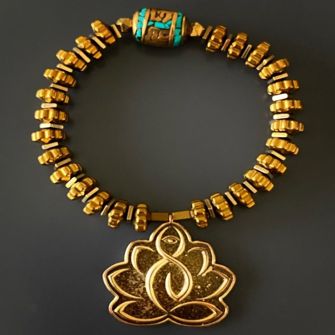 Handcrafted Flower Of Life Bracelet - Unique and spiritually infused accessory with gold color hematite beads, Lotus Flower charm, and Om Mani Padme Hum mantra bead for positive energy and luck.